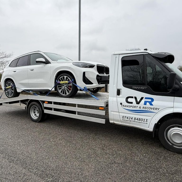BMW vehicle being transported on recovery truck in Cambridge